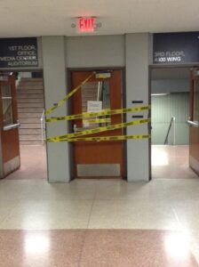 Taped up door on second floor